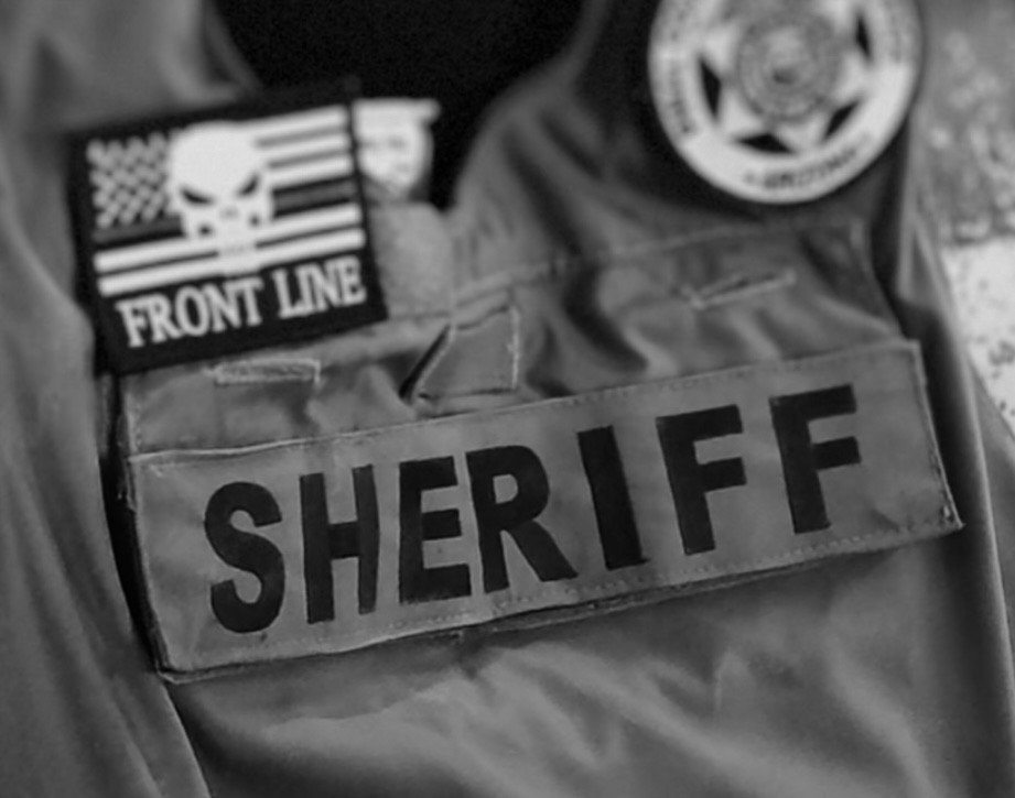 Pinal County Sheriff vest with Front Line Chemicals patch at Elite Auto Spa San Tan Valley AZ