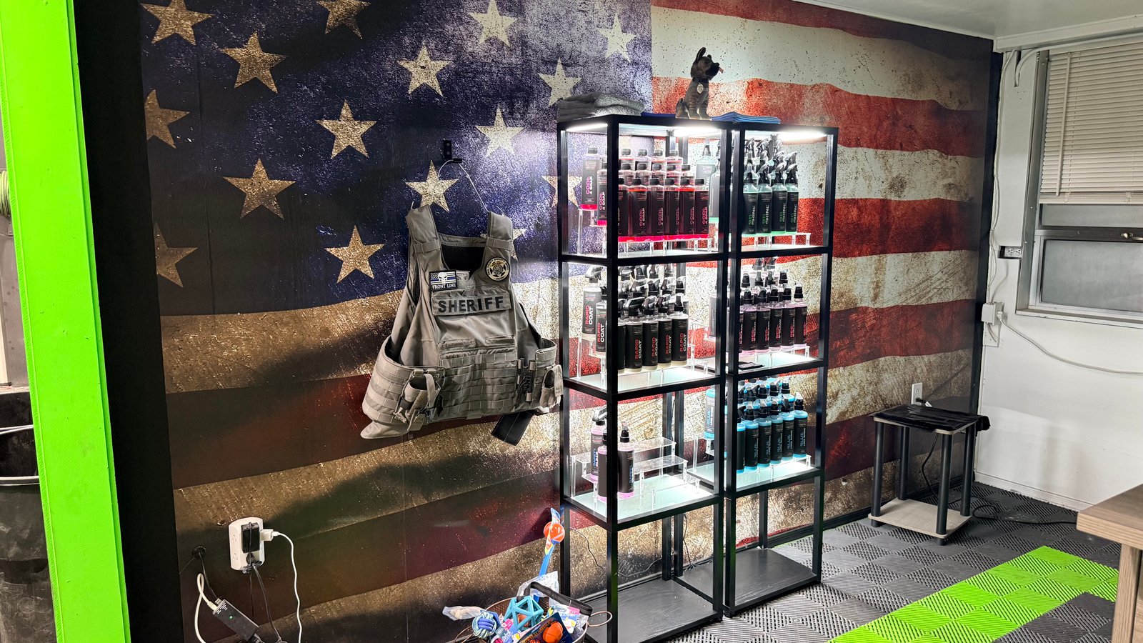 Front Line Chemicals product display and Pinal County Sheriff vest at Elite Auto Spa San Tan Valley AZ